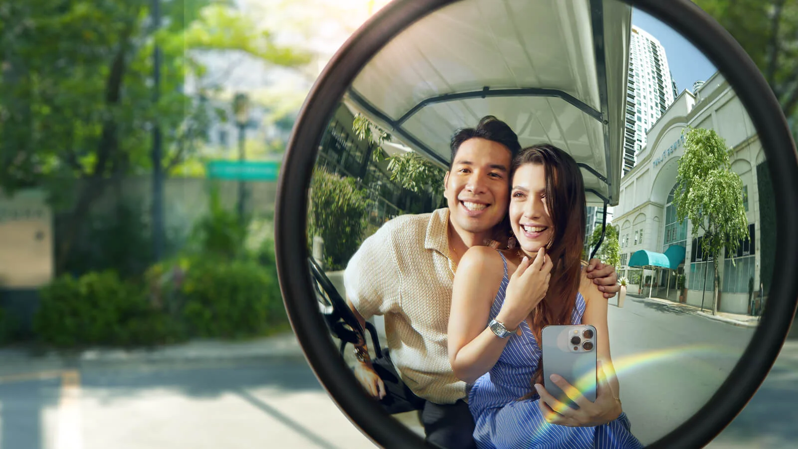 A joyful couple, captured in a sunny reflection, smiles brightly.