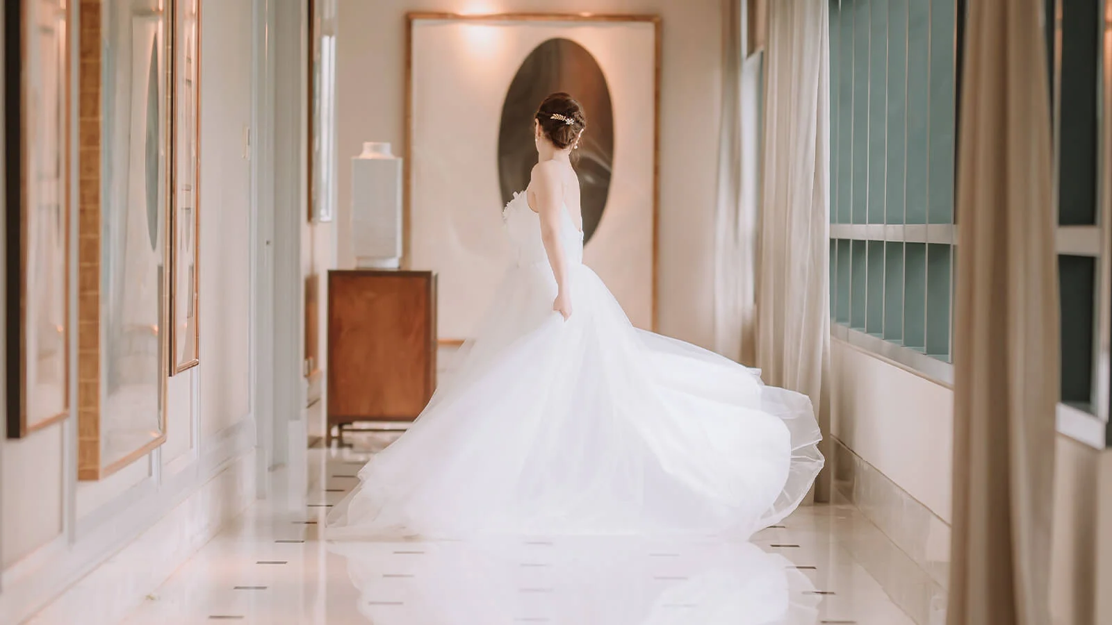 White gown, polished floor, a bride's reflection, a perfect moment.